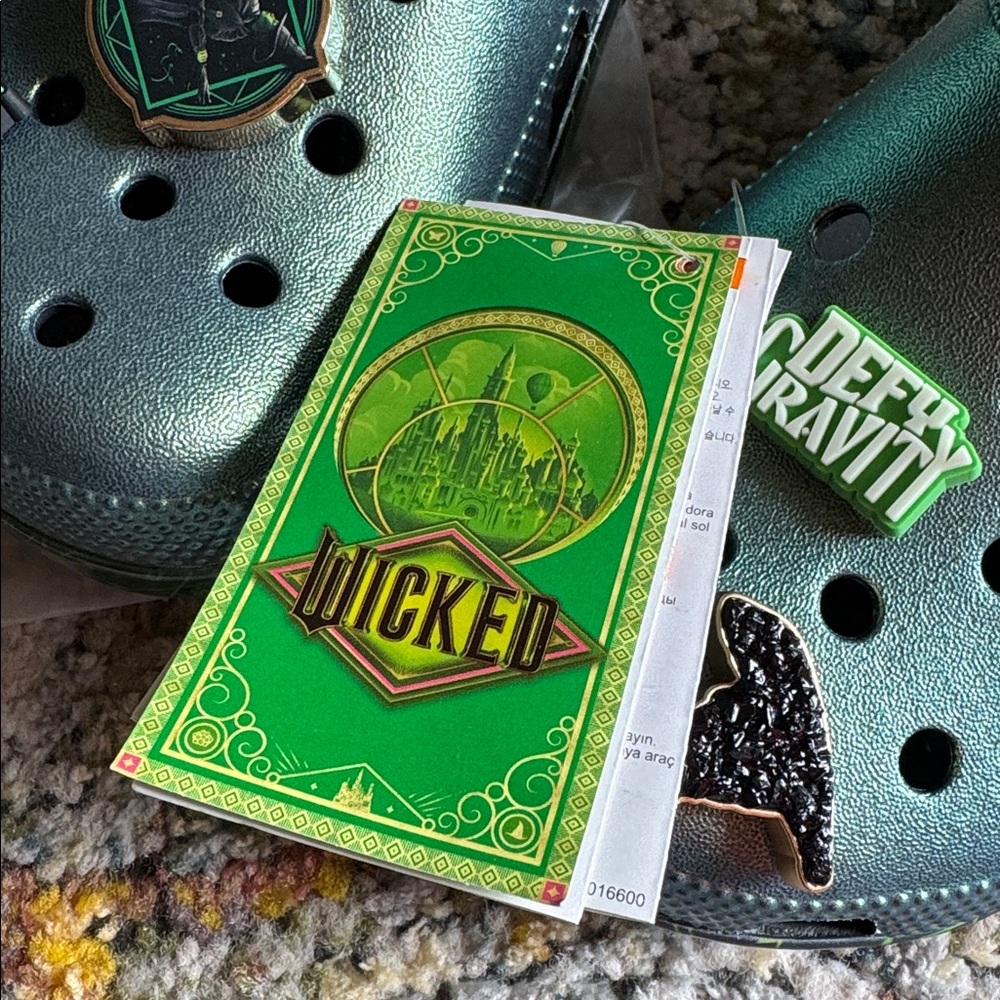 CROCS WICKED Classic Clogs with green metallic upper and themed Jibbitz charms. - Picture 3 of 8